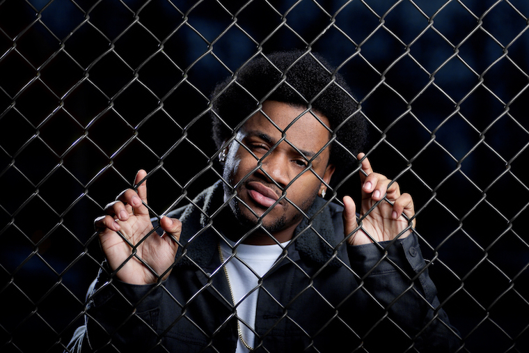 Promotional imagery for Tacoma-based rapper Dizzle Dinwiddy