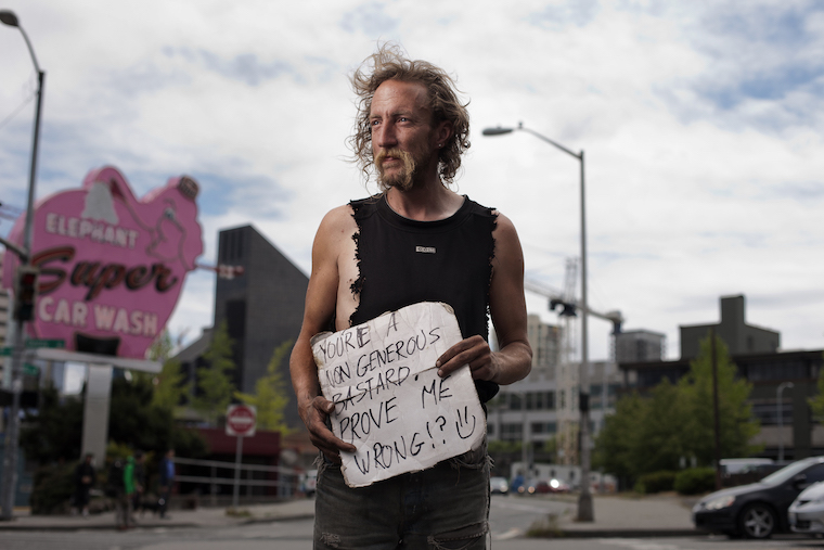 Shadow is a Seattle Native, who's been homeless for a few years now. He hangs out above the Highway 99 tunnel in downtown Seattle, where he helps locals get free parking through a secret trick he's learned with machines.